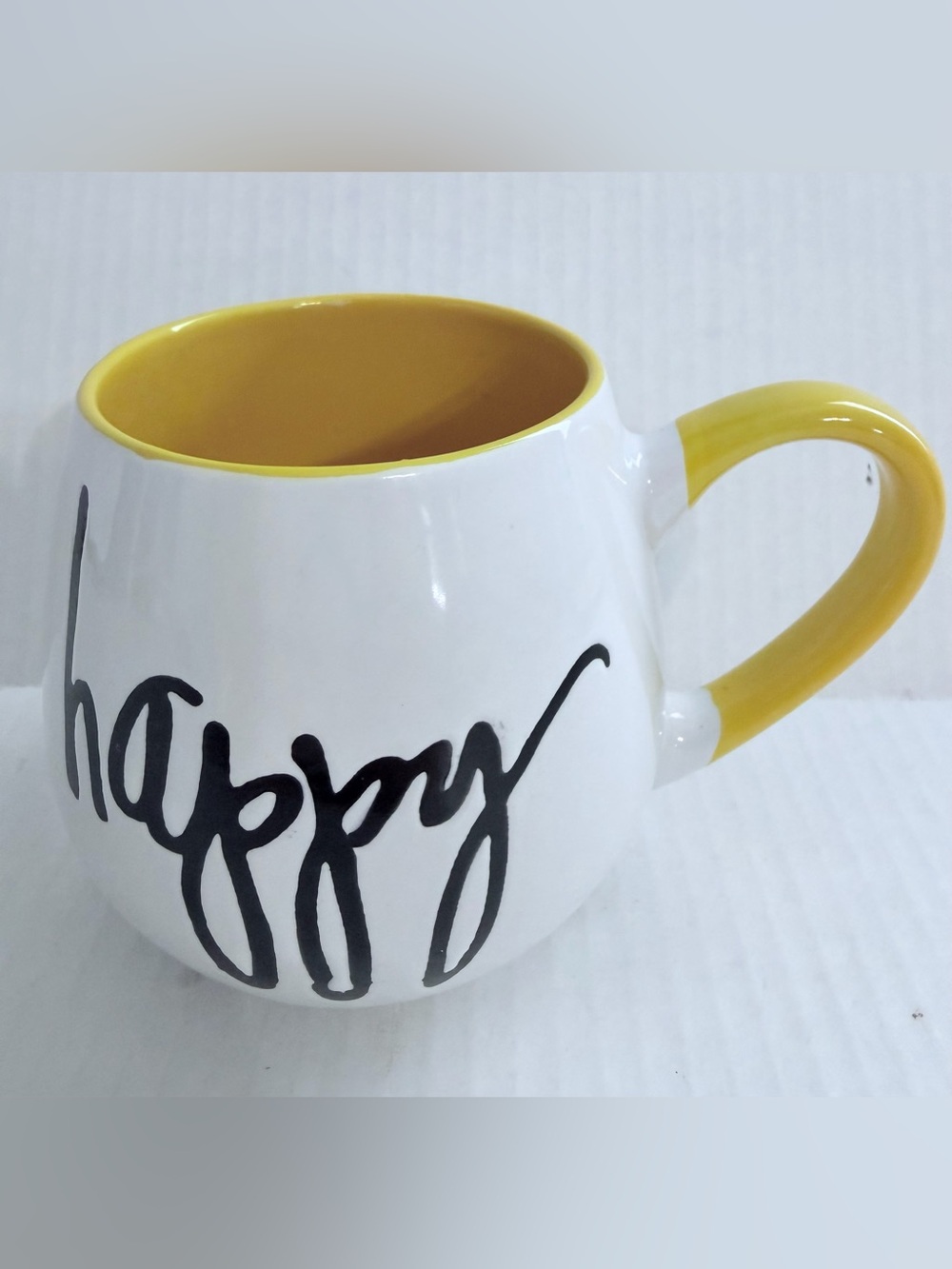 Pier 1 White Ceramic Mug with Yellow Interior and Handle, 'happy' Script